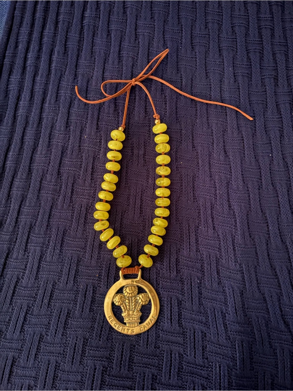 Yellow Bead Necklace with Vintage Brass Horse medallion.